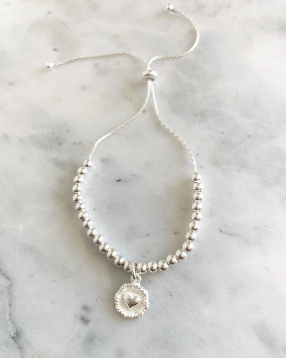 Pulsera moneda corazón
